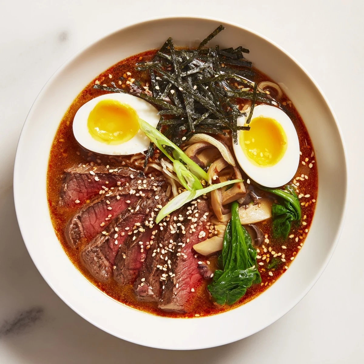 Steaming bowl of Spicy Beef Ramen with a perfectly soft boiled egg, ready to enjoy.