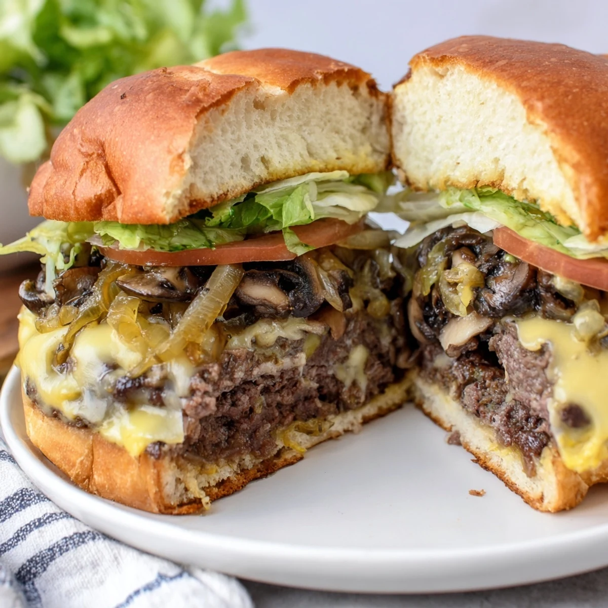Juicy Mushroom and Swiss Burger with caramelized onions on a toasted brioche bun.