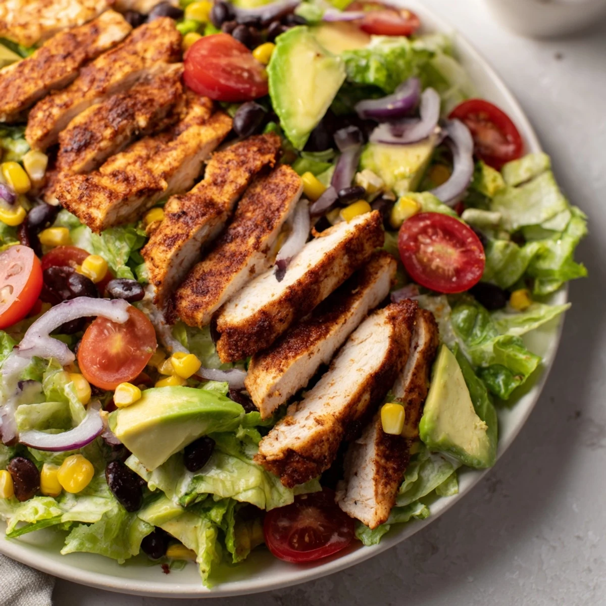 Southwest Chicken Salad in a rustic bowl, garnished with cilantro and red onion, ready for a light gluten-free lunch.