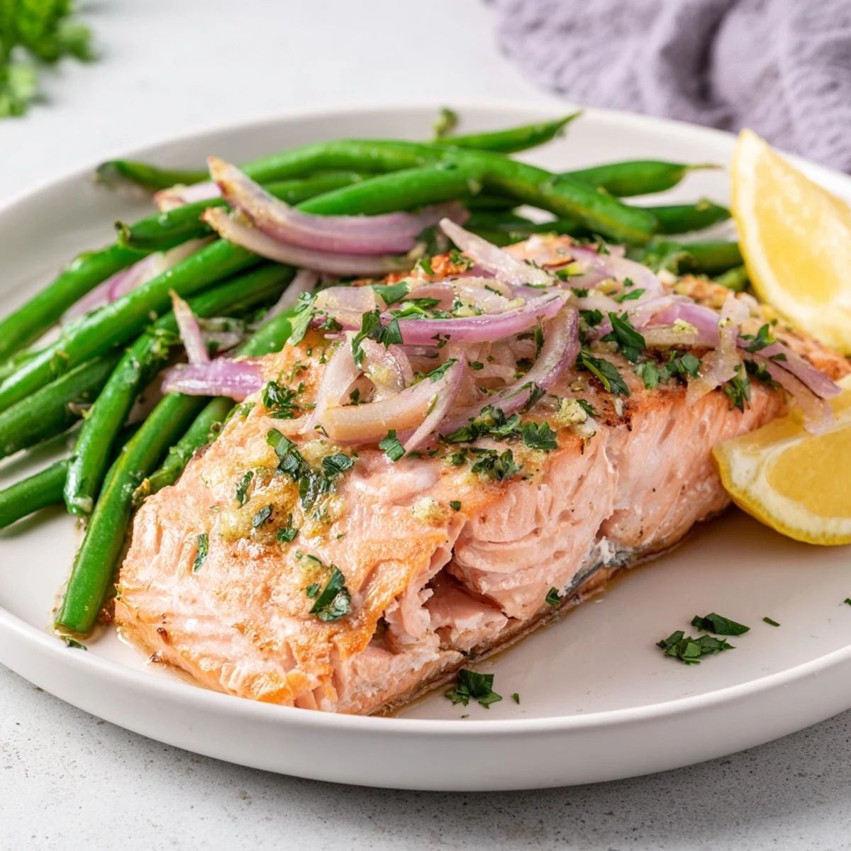 Golden roasted Sheet Pan Salmon and Green Beans with a lemon-garlic butter glaze, served hot from the oven.