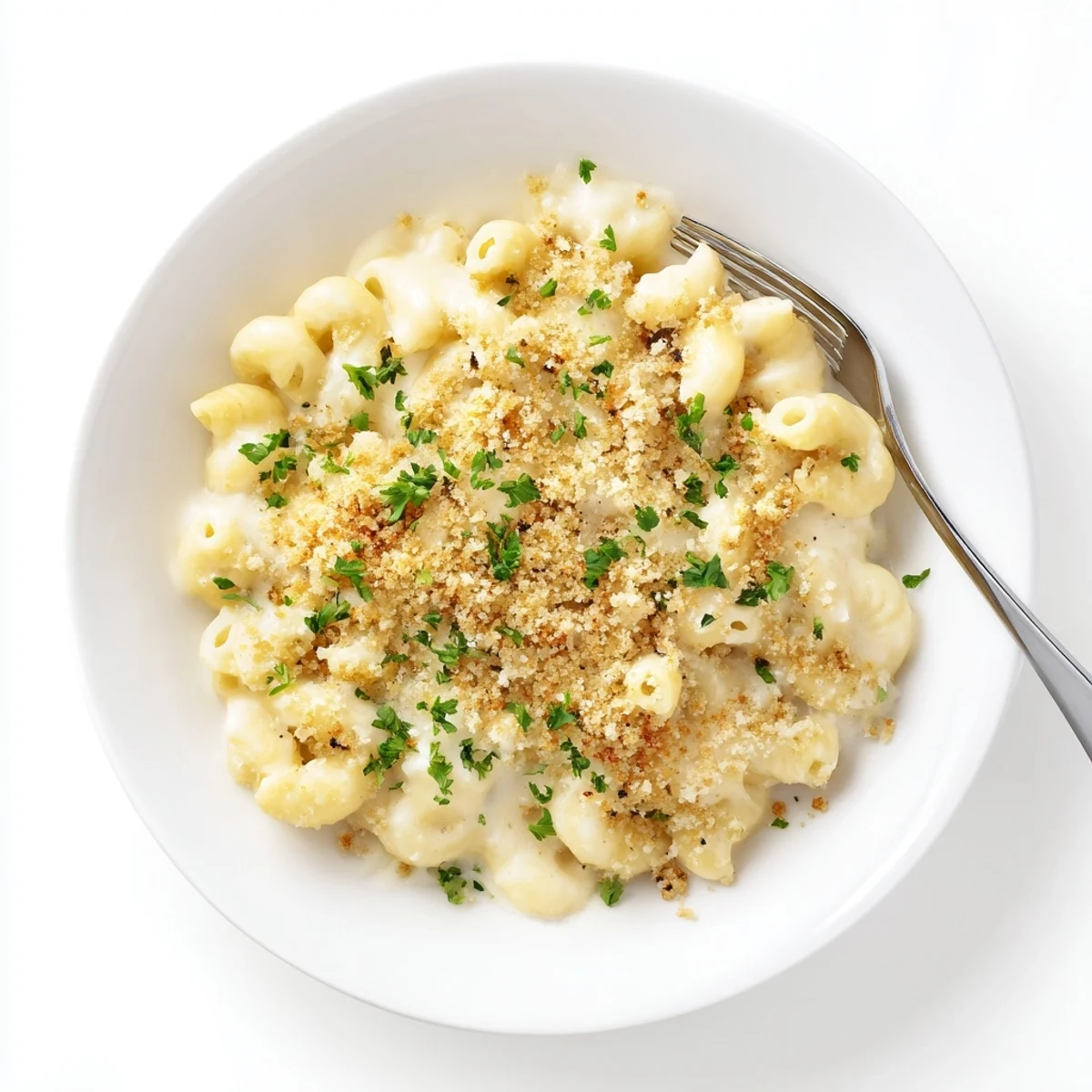 Golden, crunchy panko topping covers a creamy, baked mac and cheese pasta dish in a casserole dish.