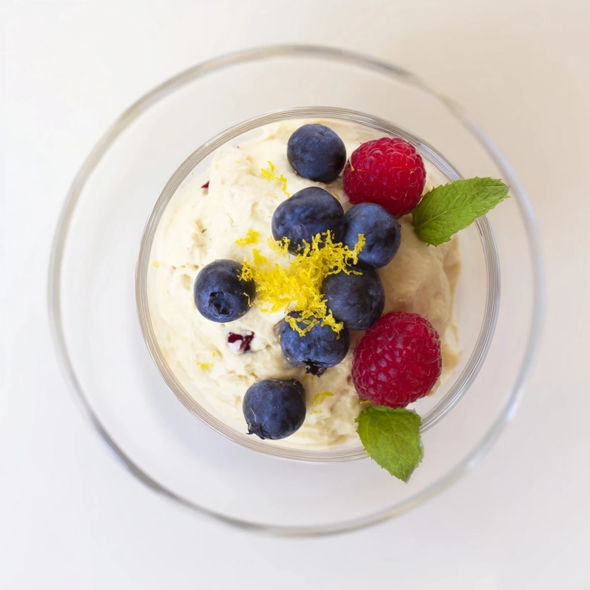 Creamy no bake lemon mascarpone mousse topped with fresh berries and mint