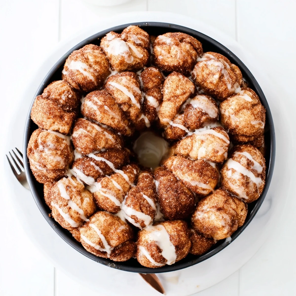 Golden high protein no sugar monkey bread with cinnamon coating pulls apart in fluffy pieces