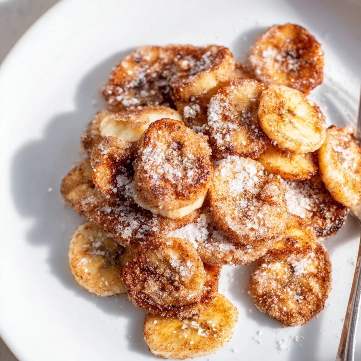Crunchy golden snack bowl showcasing Crispy Cinnamon Sugar Air Fryer Banana Chips.