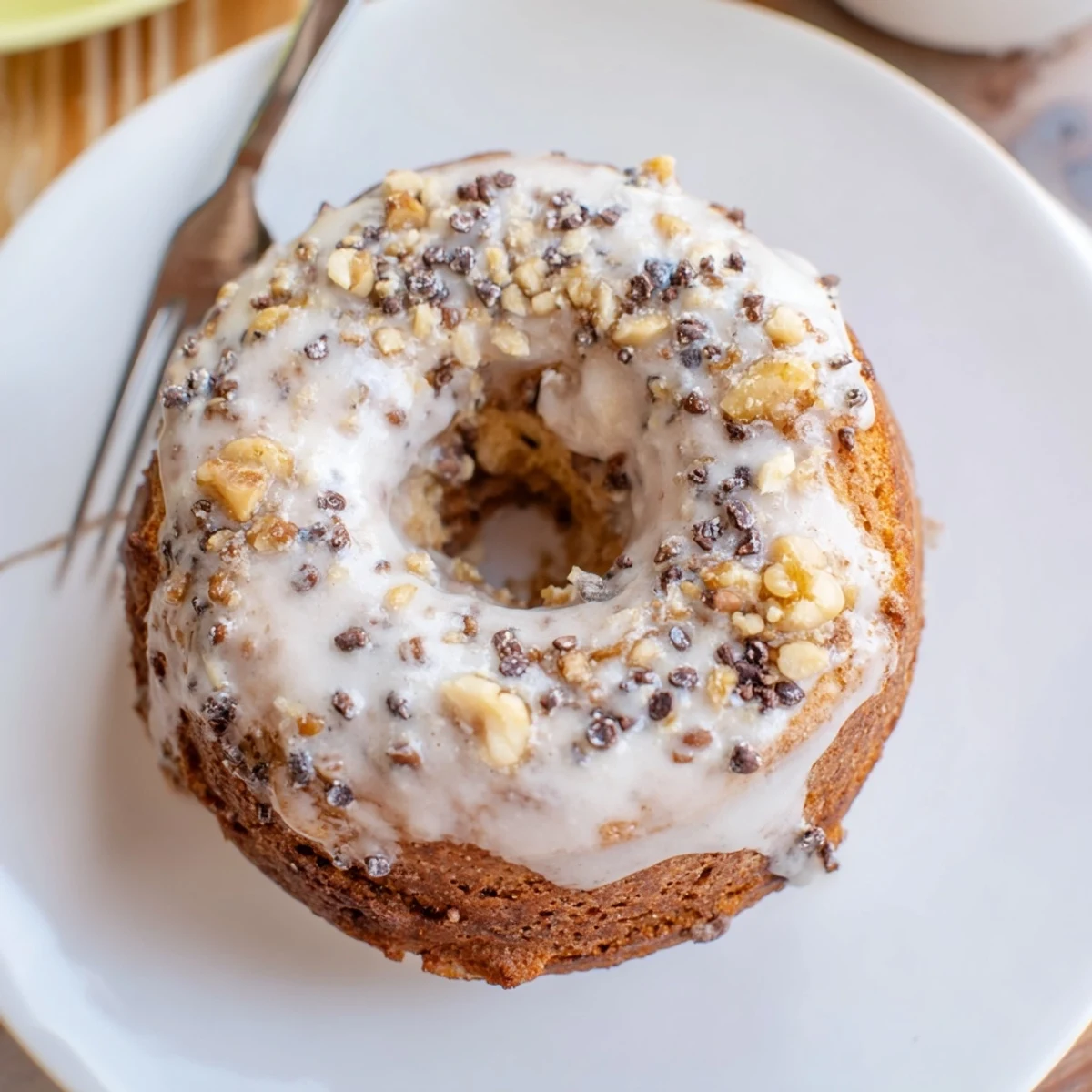 Fresh-baked Banana Donuts with cinnamon scent, served on a breakfast plate