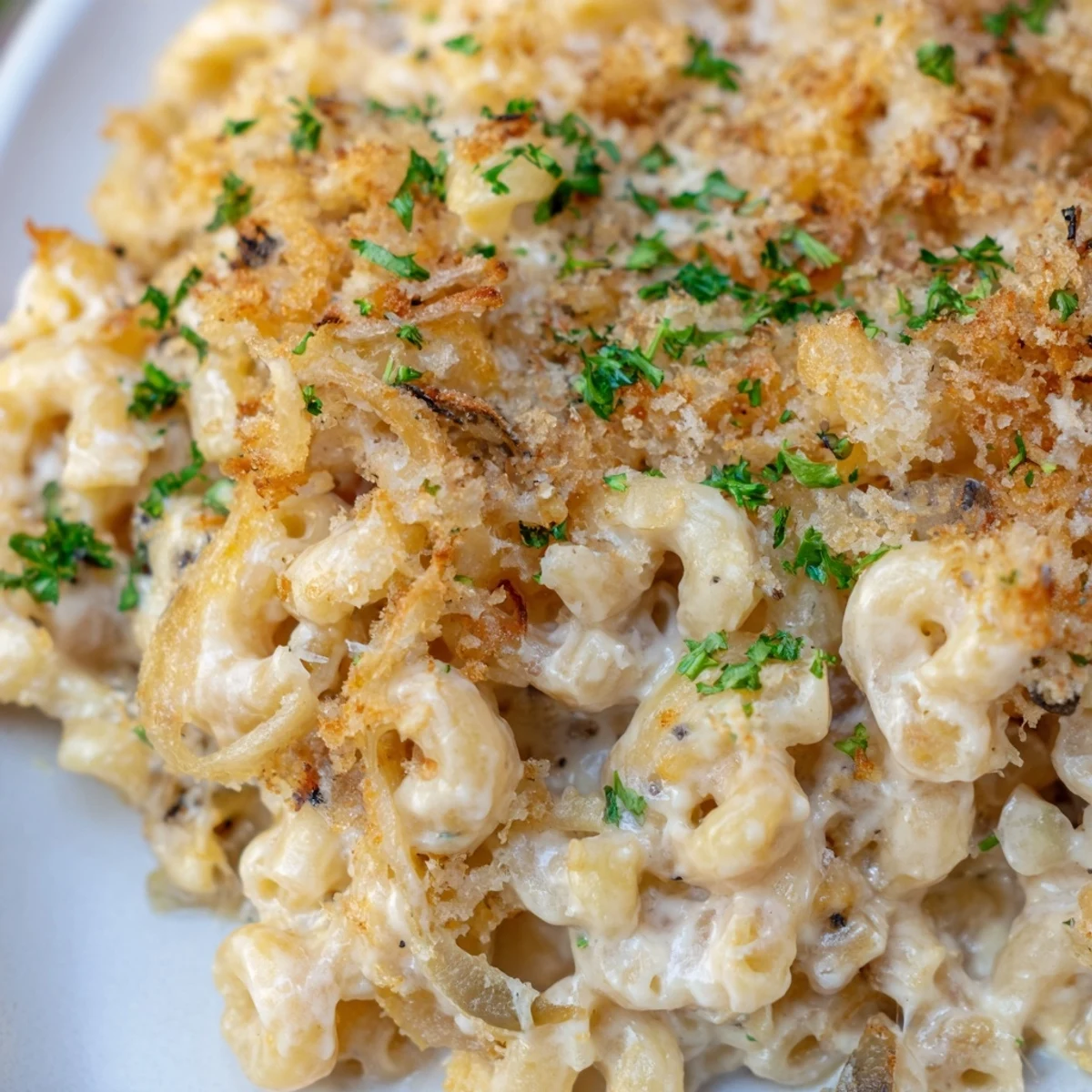 Comforting French onion mac and cheese featuring sweet caramelized onions and three cheese blend